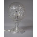 A Crystal Table lamp with Fluted and Diamond Cut Shade Raised on a Waisted Column with Circular
