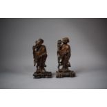 Two Oriental Carved Wooden Figures of Husband and Wife, 22cms High