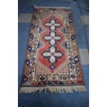 A Patterned Woollen Rug, 1.8m x 79cms