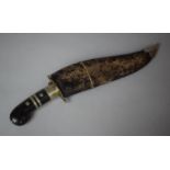 A Vintage Kukri Knife with Ebonised and Metal Banded Handle in Leather Scabbard, 44cms Wide