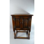 An Oak Linenfold Small Cupboard, 50cms Wide