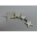 A Silver Brooch in the Form of Four Stars