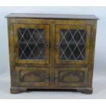 A Mid 20th Century Oak Glazed Bookcase with Cupboard Base, 106cms Wide