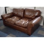 A Modern Brown Leather Three Seater Settee with Scrolled Arms by Laura Ashley