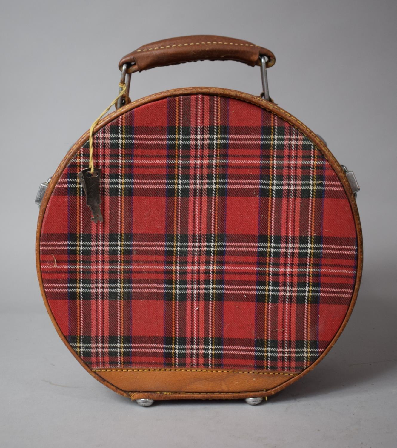 A Circular Tartan and Leather Mounted Travel Case, 24cms High