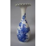 A Japanese Blue and White Vase with Wavy Rim, Decorated with Blossom and Scrolls, Character Marks to