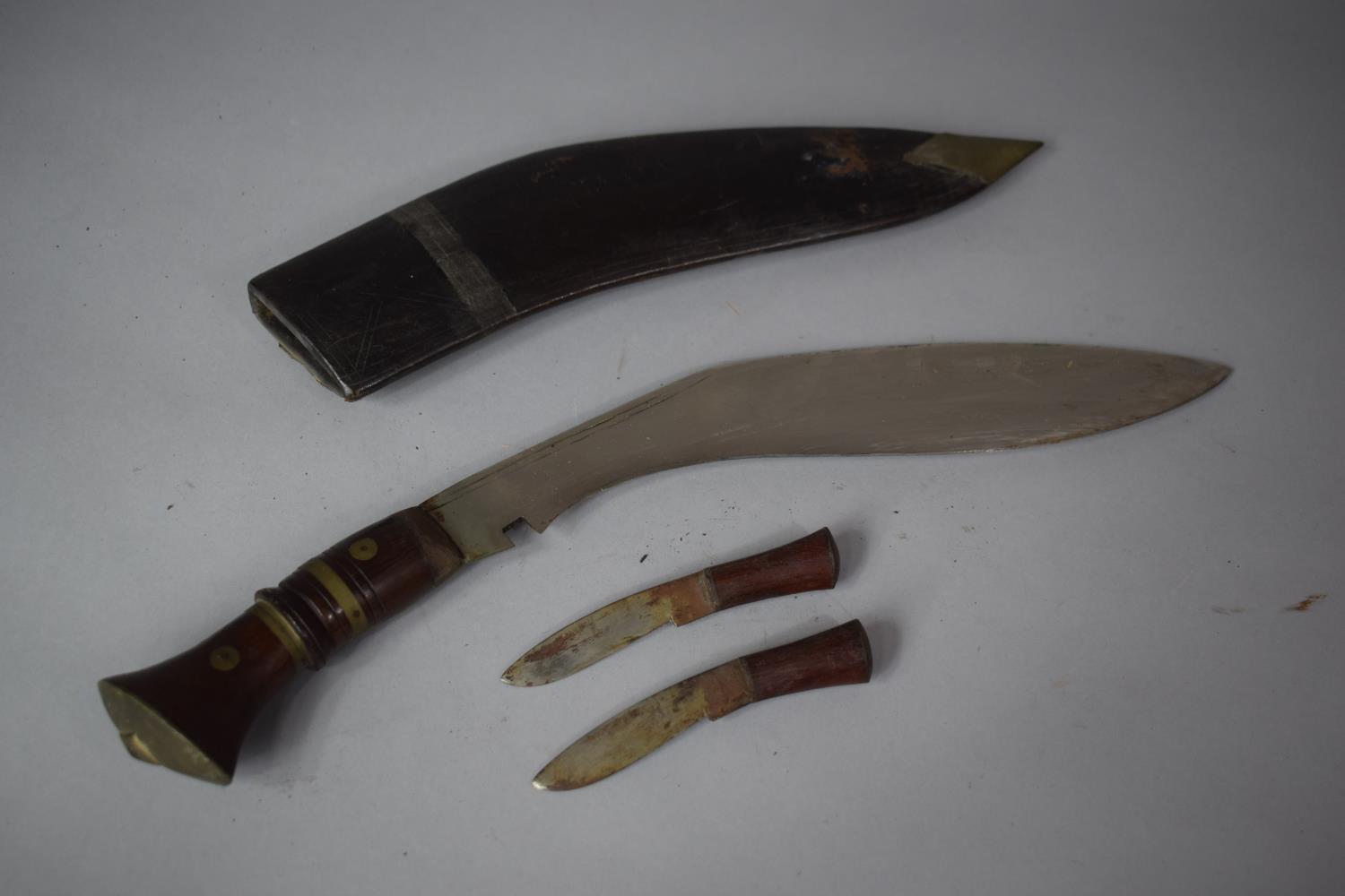 A Vintage Kukri Knife with Brass Mounted Wooden Handle Complete with Two Daggers, 45cms Wide - Image 4 of 4