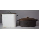 An Oval Cast Iron Lidded Cooking Pot and an Enamel Bread Bin