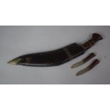 A Vintage Kukri Knife with Brass Mounted Wooden Handle Complete with Two Daggers, 45cms Wide