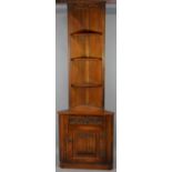 A Double Freestanding Oak Linenfold Corner Cabinet with Open Shelved Top, 67cms Wide