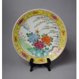 A 20th Century Chinese Famille Rose Charger Having Yellow Ground Border and Floral Decoration