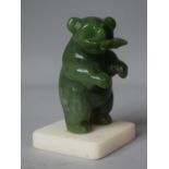 A Carved Jadeite Study of a Bear with Salmon in Mouth Set on Alabaster Plinth, 7cms High