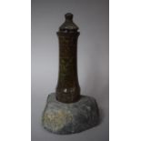 A Serpentine Marble Lighthouse Candlestick Set on Rock Base with Unrelated Lid, 30cms High