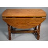 A Small Oak Drop Leaf Occasional Table, 60cms Wide