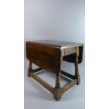 A Small Oak Drop Leaf Table, 50cms Wide