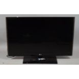 A 2012 LG Flat Screen TV, Model 42 LV55OT, with Remote Control