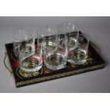 A Set of Six Glass Tumblers on Two Handled Leather Mounted Tray