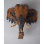 A Wall Hanging Carved Wooden Elephant Head, 33cm high