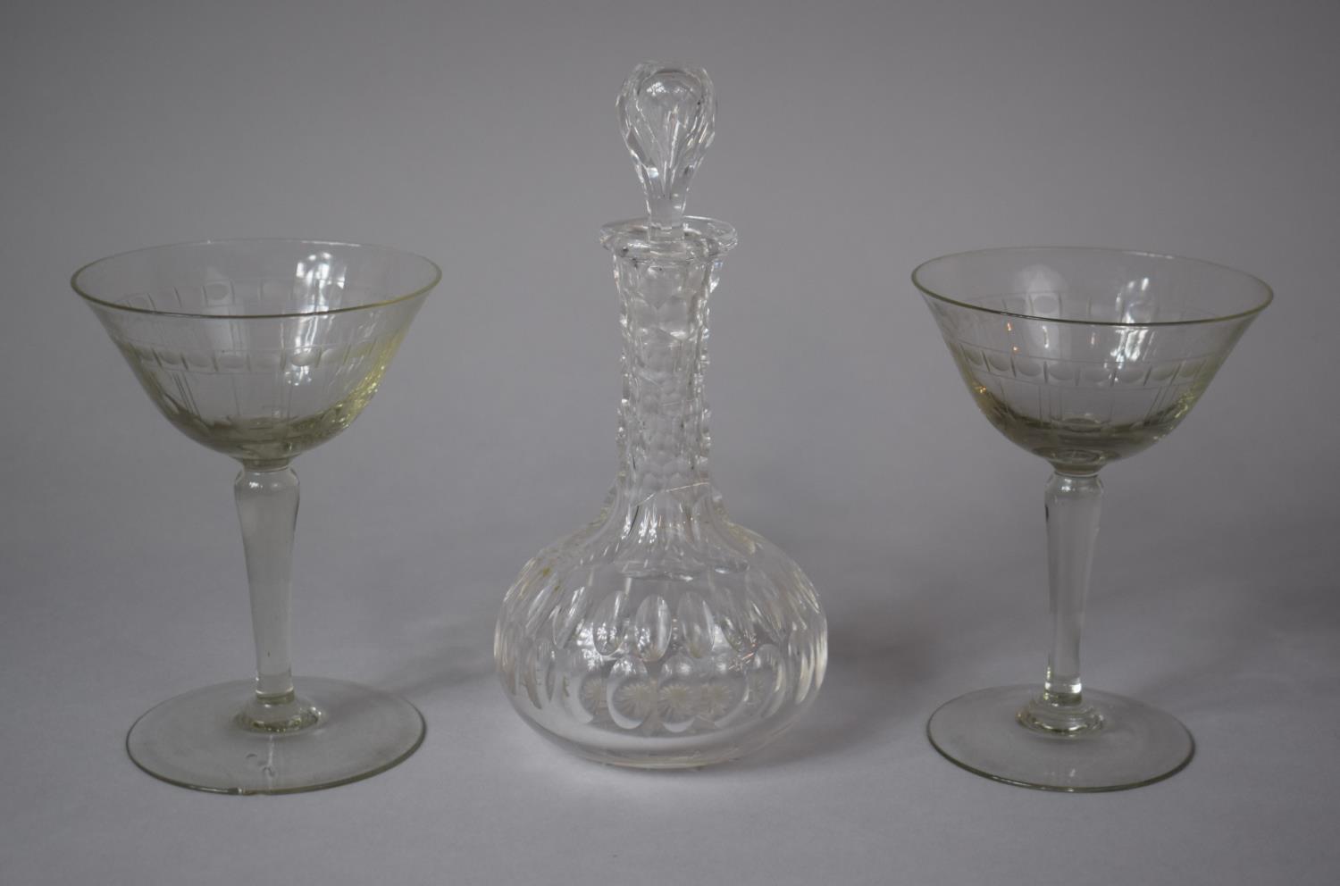 A Cordial Decanter and Pair of Engraved Cocktail Glasses