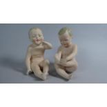 A Pair of Continental Bisque Porcelain Nude Piano Babies, 10cm High