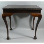 An Edwardian Mahogany Side Table on Cabriole Supports Culminating in Claw Feet, Blind Carved