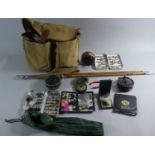 A Brady Canvas Fishing Bag Containing Fly fishing Equipment, Reels, Flies Together with a Split Cane