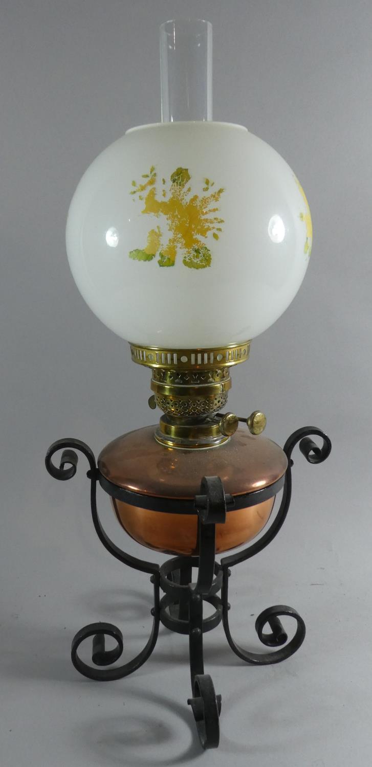 A Wrought Iron Based Oil Lamp with Copper Reservoir, Brass Fittings and Opaque Glass Shade, 60cm