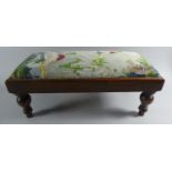 A Modern Rectangular Tapestry Topped Upholstered Footstool on Turned Supports, 56cm Wide