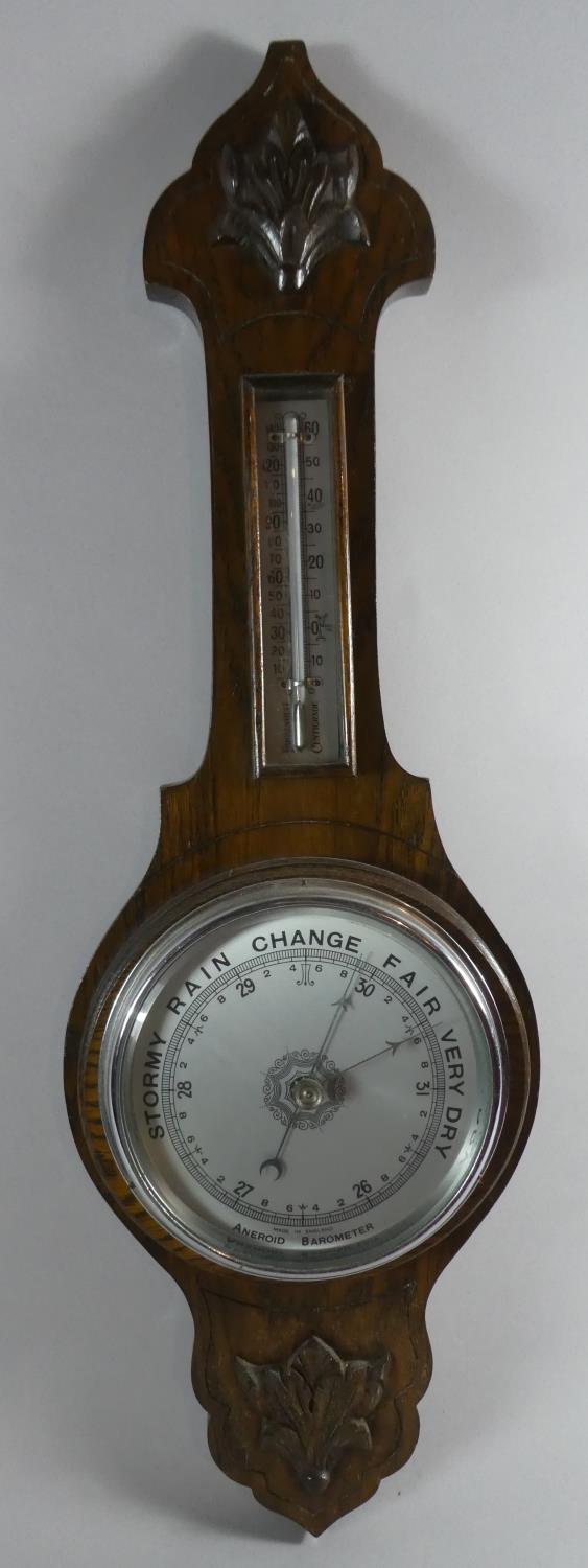 A Late Victorian Oak Aneroid Wheel Barometer with Thermometer, 67cm High