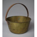 A Brass Jam Kettle with Iron Loop Handle, 28.5cm Diameter