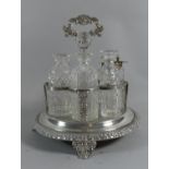 A Late Victorian/Edwardian Silver Plated and Glass Seven Bottle Cruet (Some Stoppers Missing) on