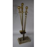 A Brass Fire Companion Set Containing Long Handled Fire Irons on Galleried Stand