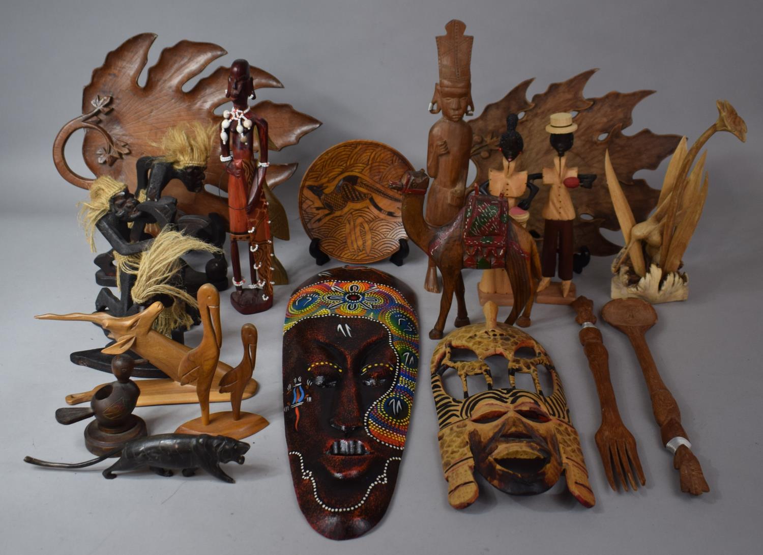 A Box Containing Various Carved Wooden Souvenir Figures, Trays, Animals, Masks etc