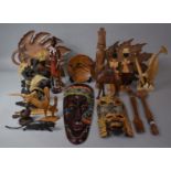A Box Containing Various Carved Wooden Souvenir Figures, Trays, Animals, Masks etc