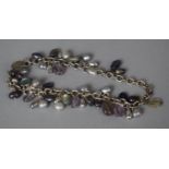 A Silver Bracelet with Fresh Water Pearl and Purple Stones