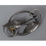 An Early 20th Century Silver Brooch in the Form of Leaves and Scrolls with Arts and Crafts