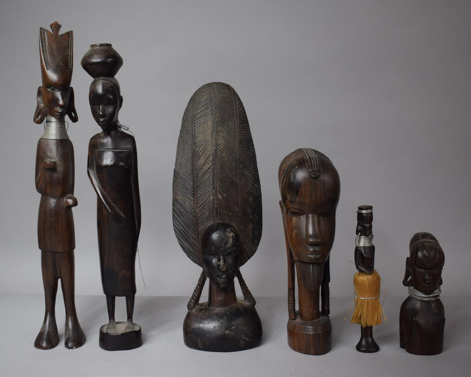 A Collection of African Tribal Carved Wooden Figures to Include Busts etc