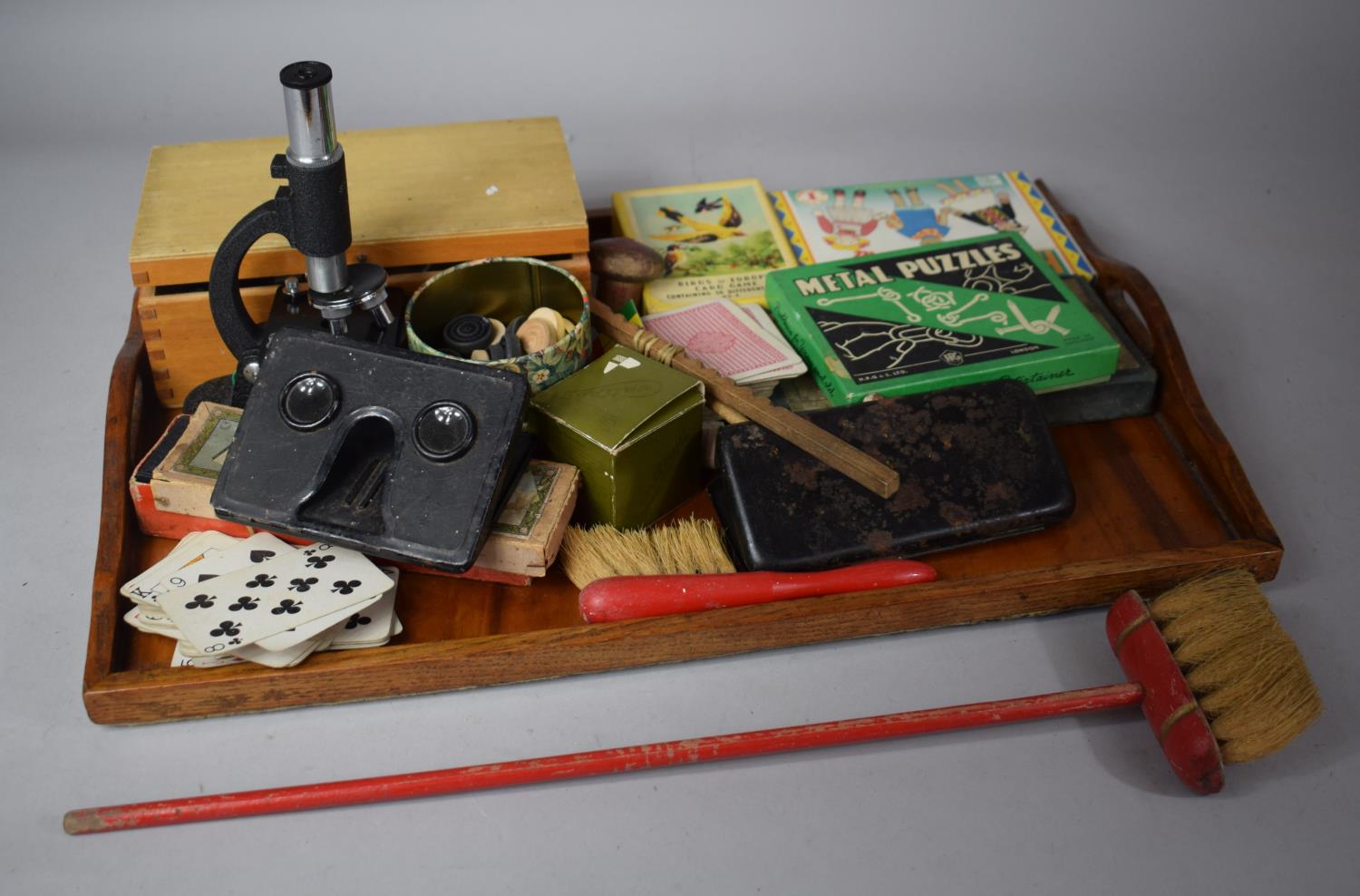 A Tray of Sundries to Include Stereoscopic Viewer, Cased Microscope, Metal Puzzles, Drawing