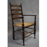 A Rush Seated Oak Framed Ladder Back Armchair with Brass Commemorative Plaque, "In Remembrance of