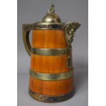 A Silver Plate Banded Oak Mask Head Lidded Jug with Ceramic Inner, 25cm High