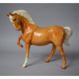 A Beswick Palomino, Head Tucked, Leg up, Model No.1549