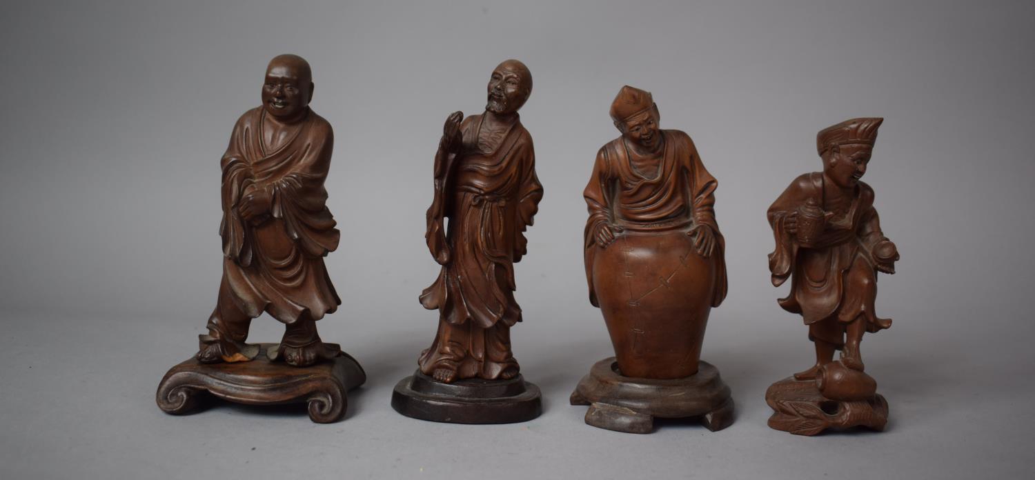 A Collection of Four Mid/Late 20th Century Oriental Carved Wood Okimonos of Elders, Tallest 14cm