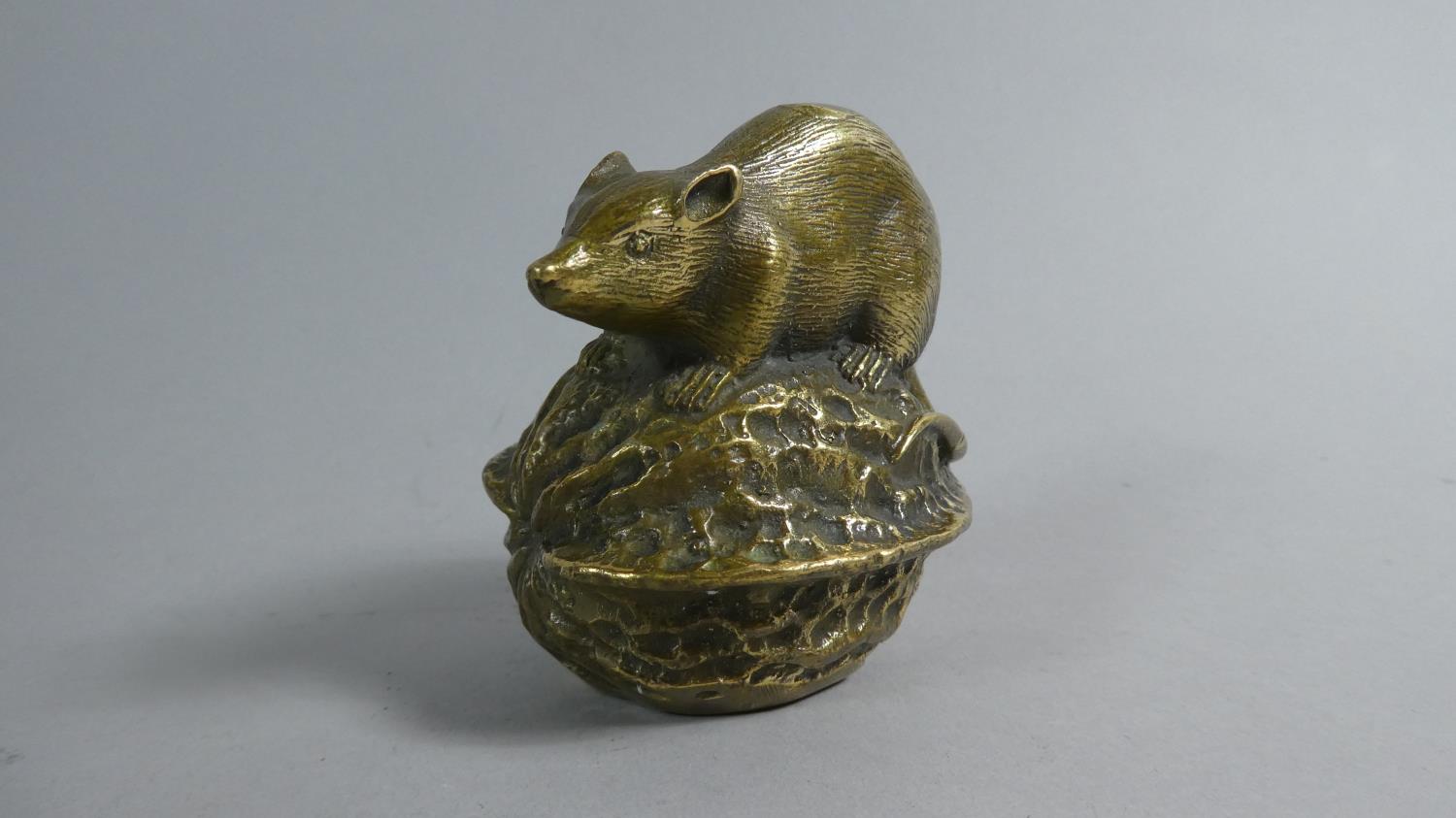 A Cast Bronze Study of a Mouse Mounted on Walnut, 7cm High