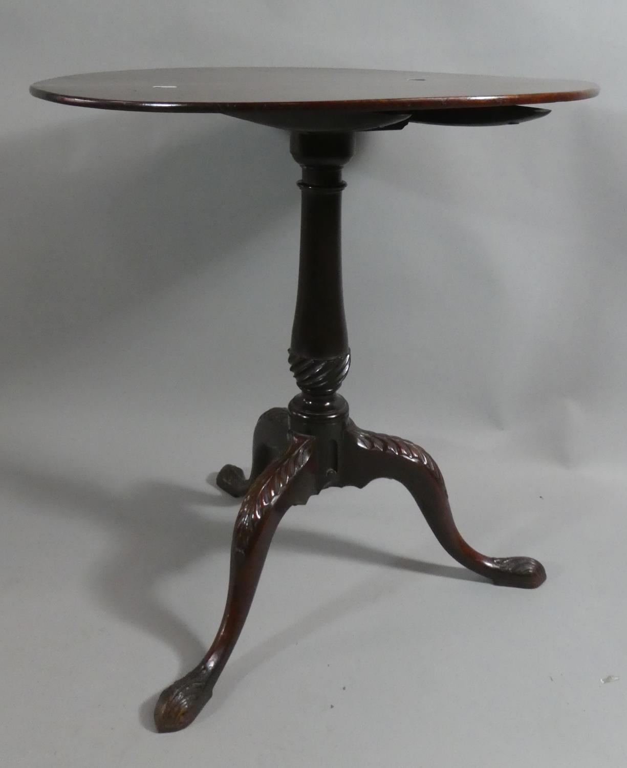 A George II Mahogany Snap Top Tripod Table with Vase Support and Acanthus Carving to scrolled