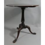 A George II Mahogany Snap Top Tripod Table with Vase Support and Acanthus Carving to scrolled