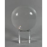 A Modern Crystal Ball on Perspex Stand