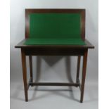 An Edwardian Lift and Twist Mahogany Games Table with Green Baize Playing Surface, 75cm Wide