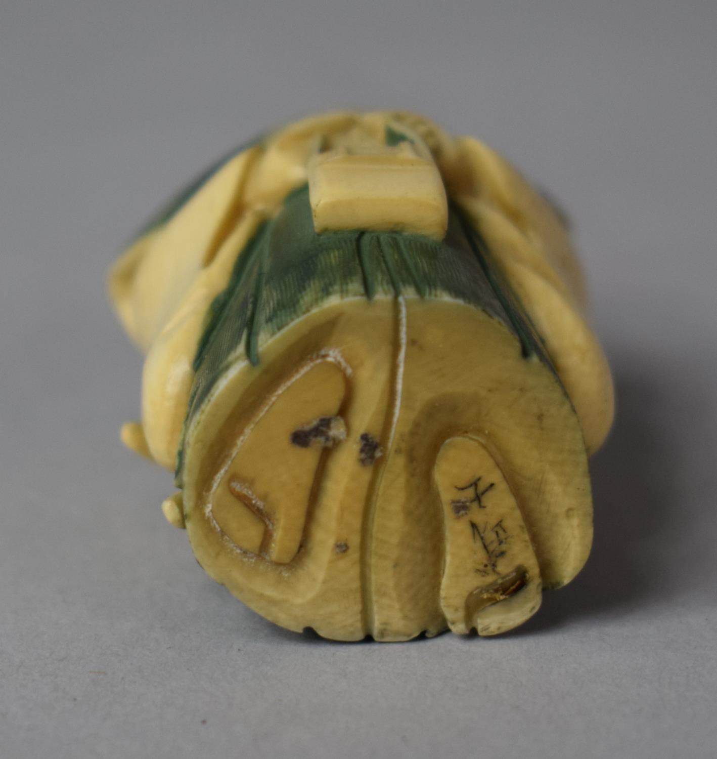 An Early 20th Century Japanese Carved Netsuke in the Form of a Scholar with Scroll in Hand Decorated - Image 3 of 3