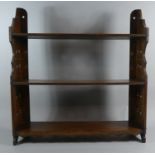 An Edwardian Mahogany Three Tier Wall Mounting Shelf with Pierced Supports, 57cm Wide