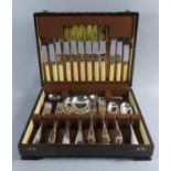 An Edwardian Oak Cased Canteen of Silver Plated and Bone Handled Cutlery